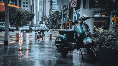 Ride a motorcycle in the street during the day
